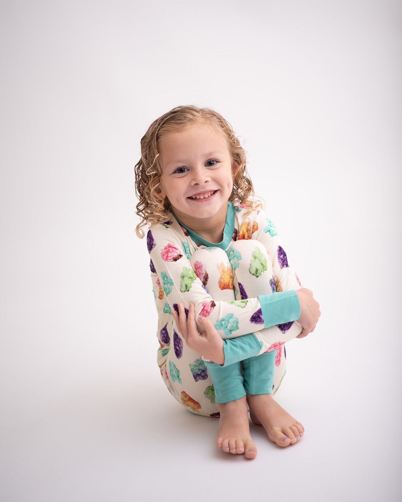 Girl wearing bamboo pajamas and smiling at camera
