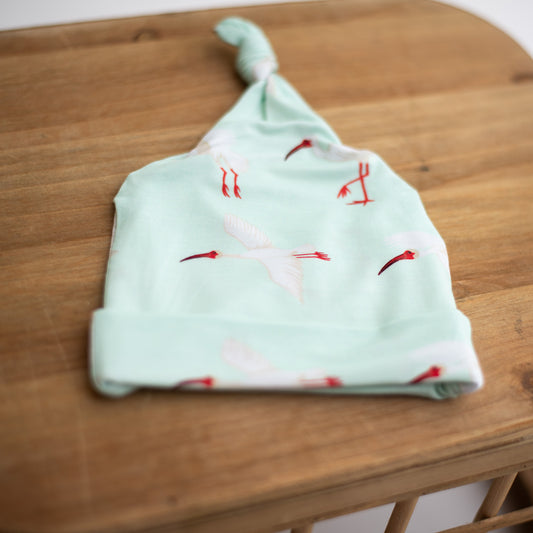 baby hat with top knot in white ibis print